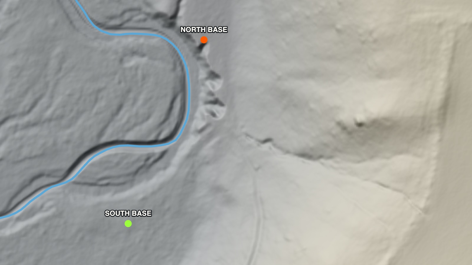 The bare ground from the lidar survey: the creek looping under the bluff, with the north and south bases marked