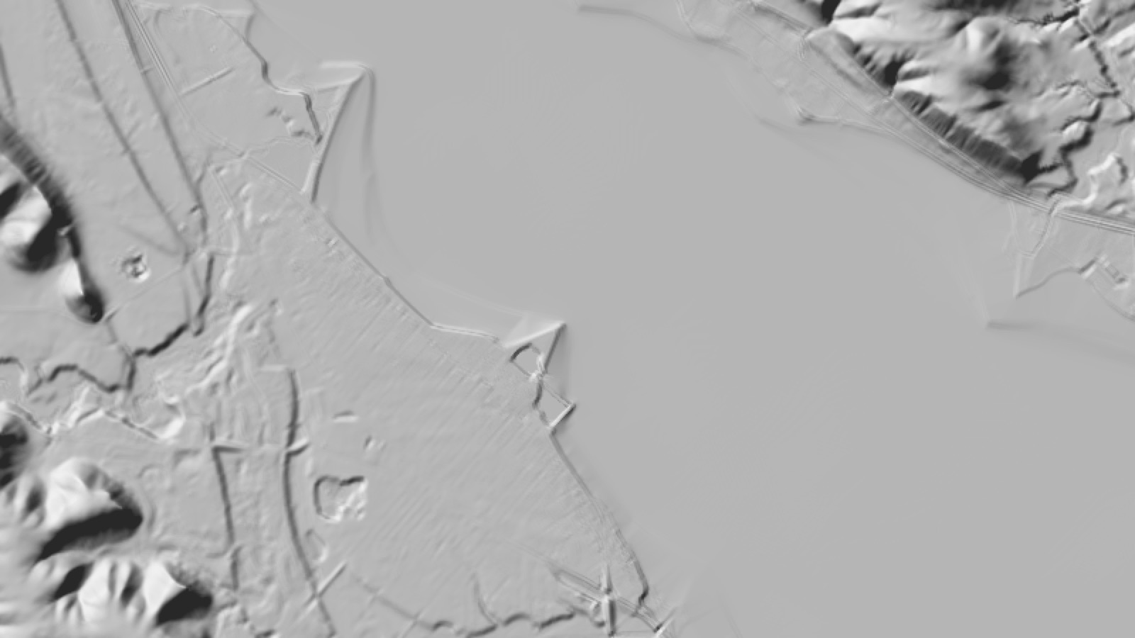 Grey relief of the Lake City shore: the bluffs, the roads and the marina point